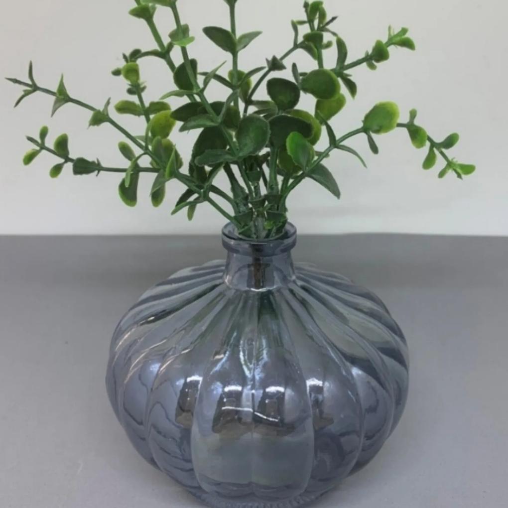 Vaso de vidro com brilho e planta
